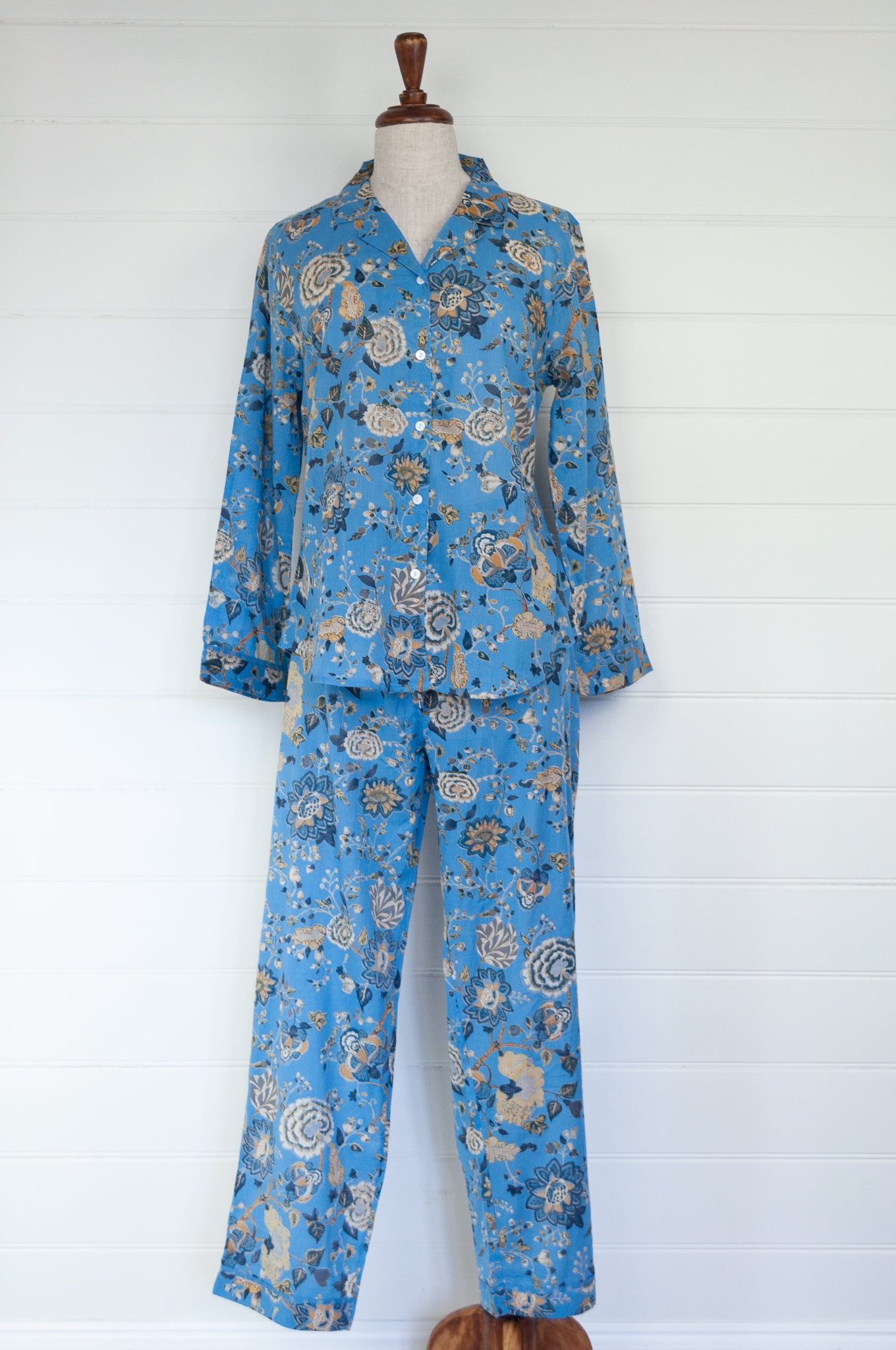 Juniper Hearth cotton voile pyjamas in Magenta sky floral print on sky blue.