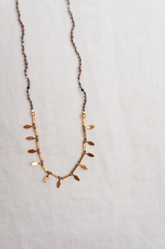 Mary Gaitani handmade pyrite necklace with gold charms.
