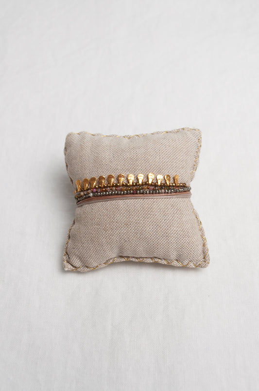 Mary Gaitani hand tooled gold teardrop charms on stranded cords with semi-precious stones.
