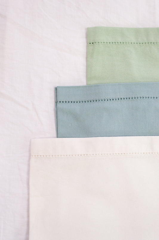 Plain cotton napkins with faggot hem detail in three colours, white, celadon and sage.
