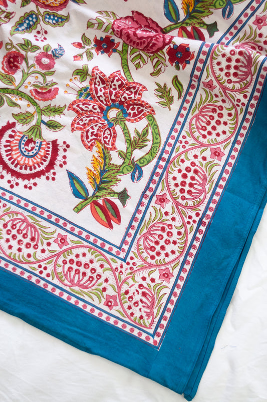 Floral blockprint large table cloth bedcover with pomegranates in pinks, red, blue and green.