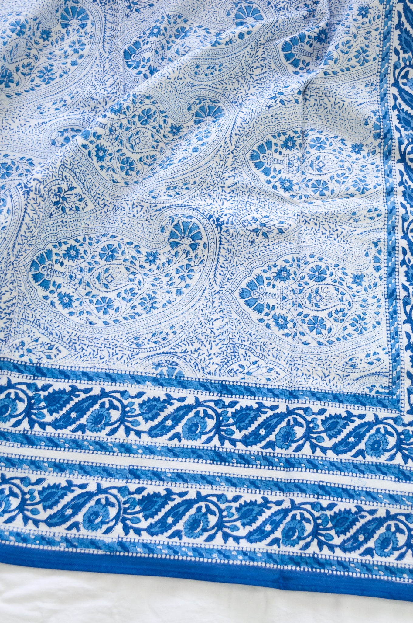 Blue and white paisley tablecloth, blockprinted by hand.