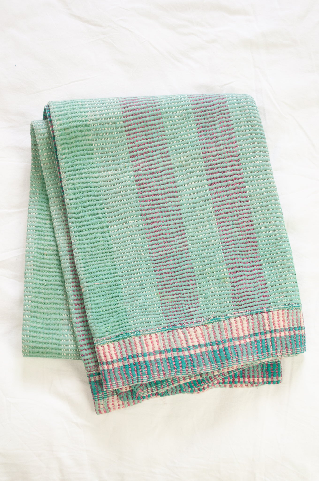 Vintage kantha quilt in pastel stripes and checks, mint, rose pink, lavender and white.