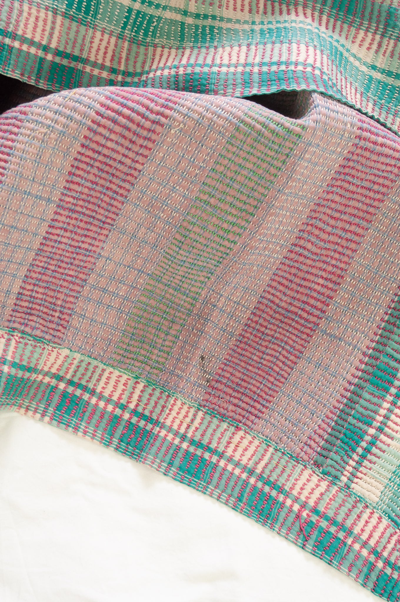 Vintage kantha quilt in pastel stripes and checks, mint, rose pink, lavender and white.