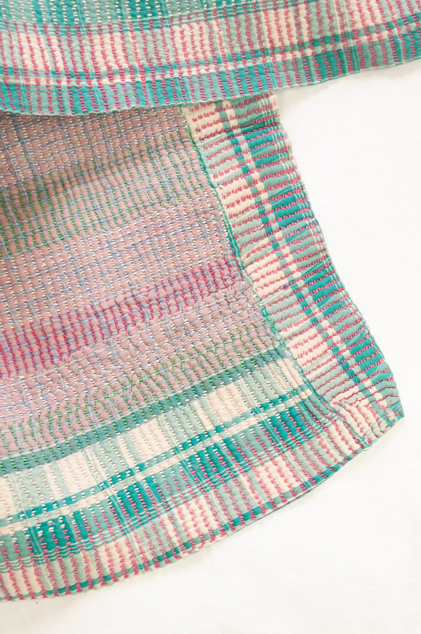 Vintage kantha quilt in pastel stripes and checks, mint, rose pink, lavender and white.