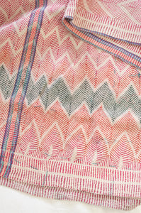 Vintage lohori wave stitched kantha quilt in  red, pink, green and blue on white.