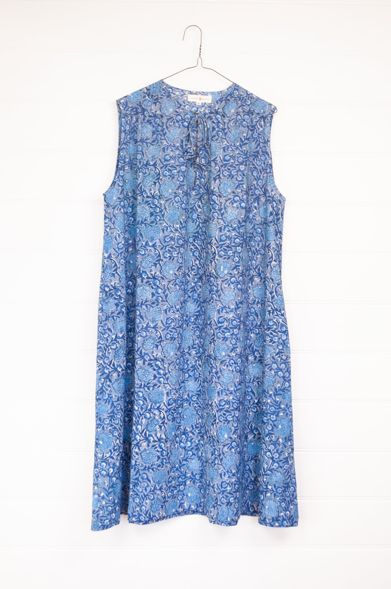 Juniper Hearth Stella dress in blue grey blockprint floral cotton, A-line sleeveless with front ties.