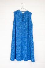 Load image into Gallery viewer, Juniper Hearth Stella dress in cornflower blue blockprint floral cotton, A-line sleeveless with front ties.