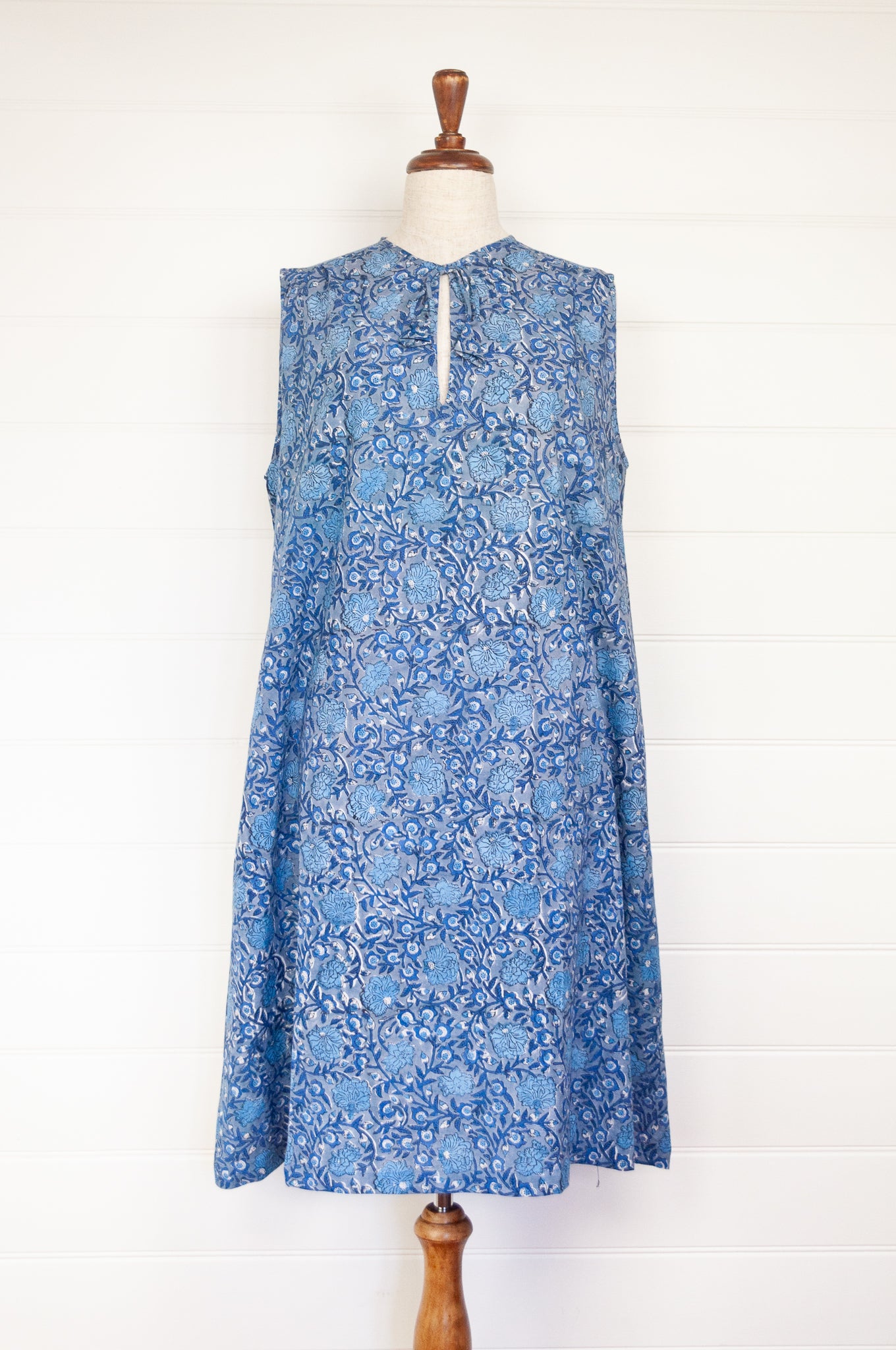 Juniper Hearth Stella dress in blue grey blockprint floral cotton, A-line sleeveless with front ties.