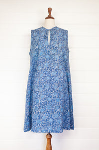 Juniper Hearth Stella dress in blue grey blockprint floral cotton, A-line sleeveless with front ties.