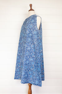 Juniper Hearth Stella dress in blue grey blockprint floral cotton, A-line sleeveless with front ties.