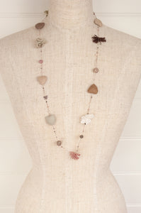 Sophie Digard hand made linen necklace, a string of hearts, flowers and beads in neutral tones.