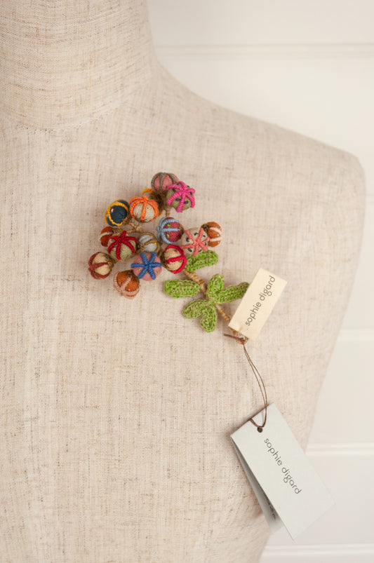 Sophie Digard handmade linen flower brooch in warm colours.