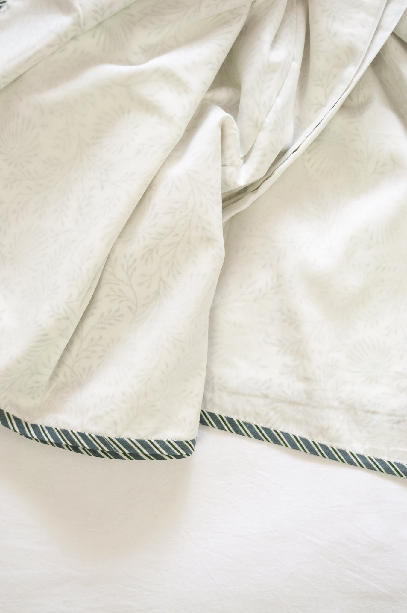 Pure cotton muslin dohar with blockprinted centre in subtle olive floral design.