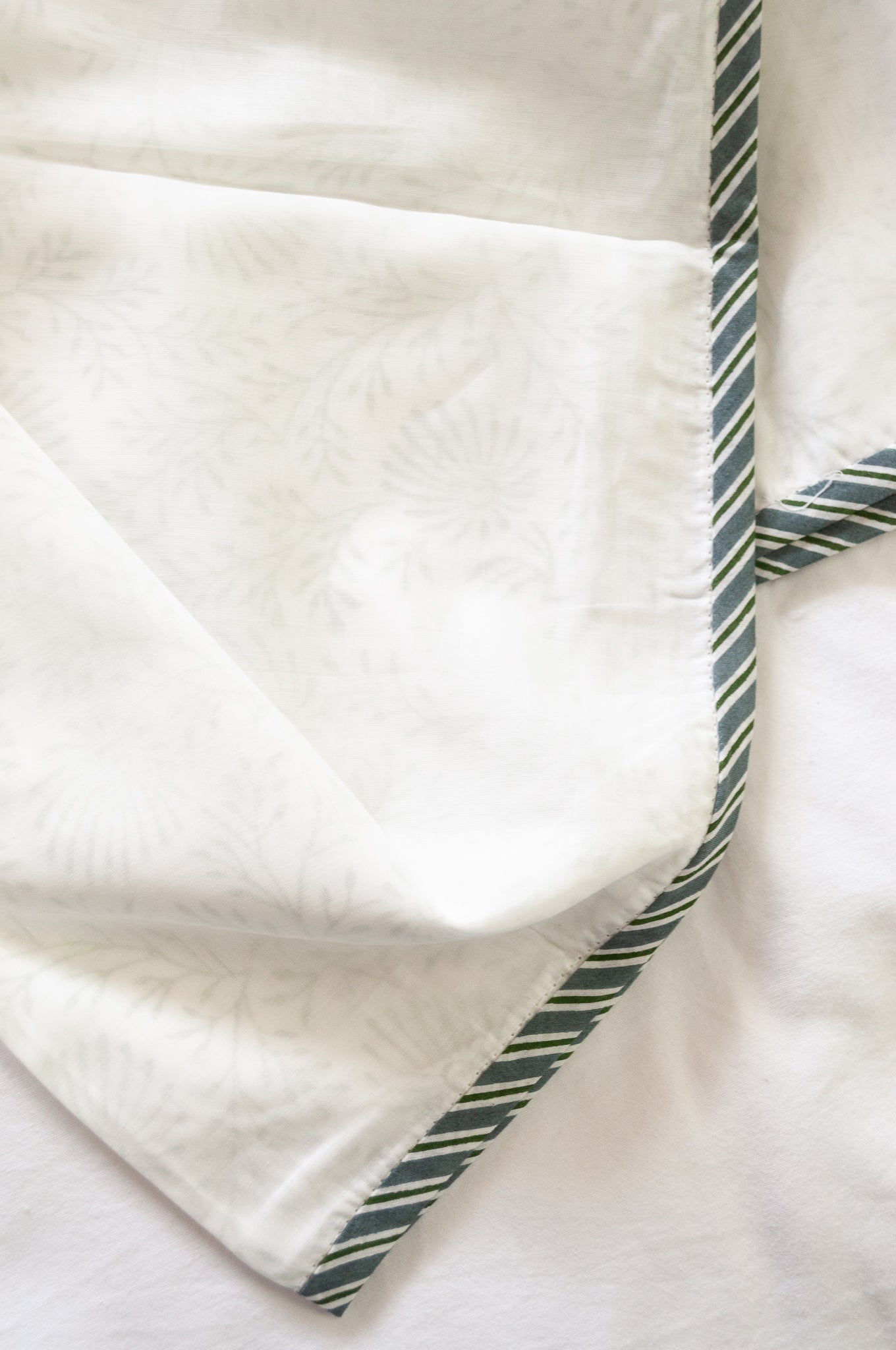 Pure cotton muslin dohar with blockprinted centre in subtle olive floral design.