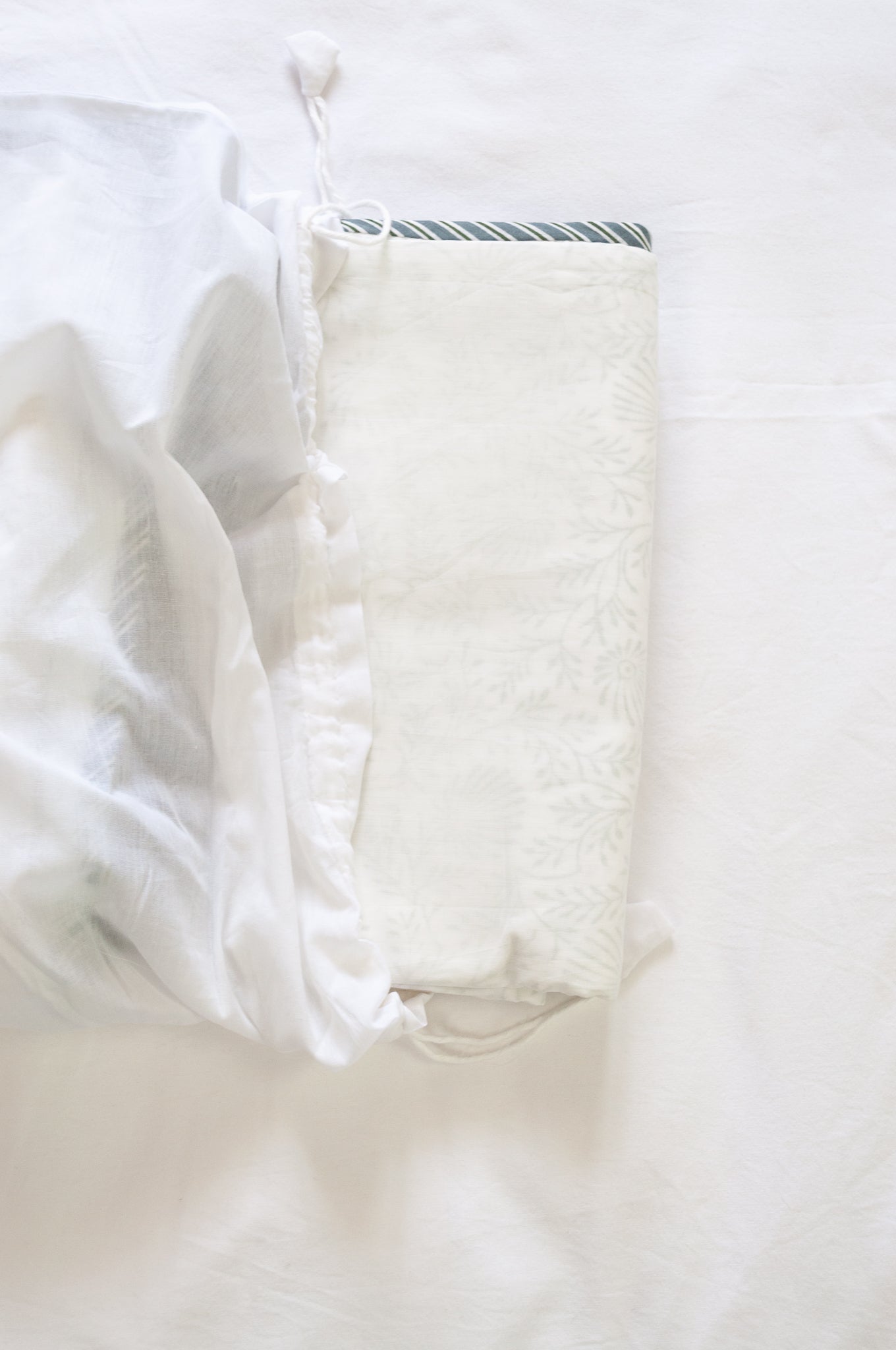 Pure cotton muslin dohar with blockprinted centre in subtle olive floral design.