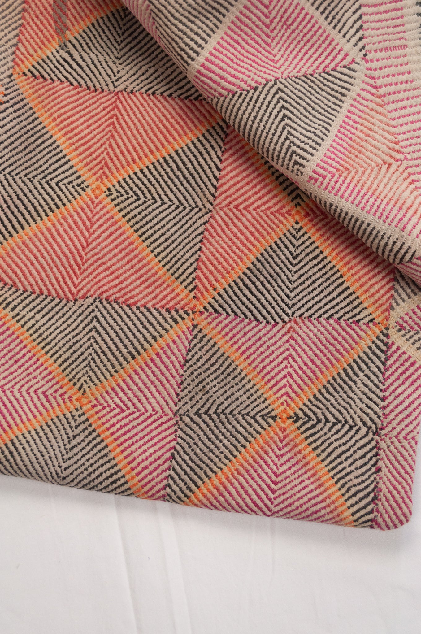 Vintage lohori wave kantha quilt red and olive and orange triangle stitch pattern.