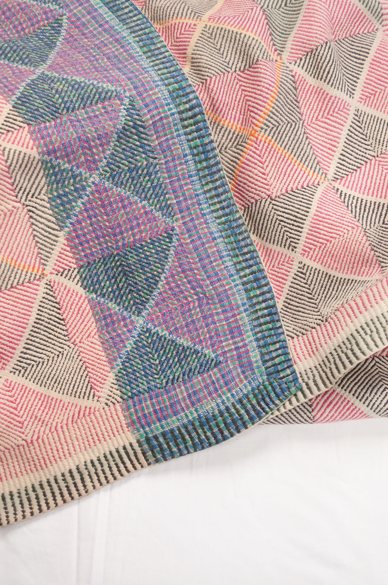 Vintage lohori wave kantha quilt red and olive and orange triangle stitch pattern.