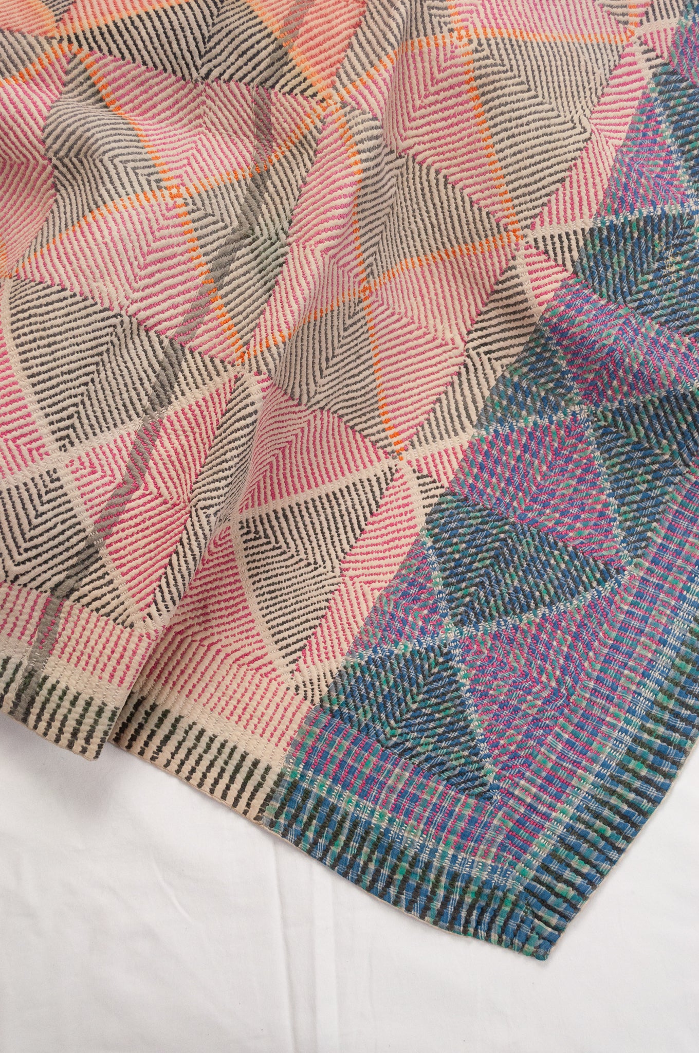 Vintage lohori wave kantha quilt red and olive and orange triangle stitch pattern.