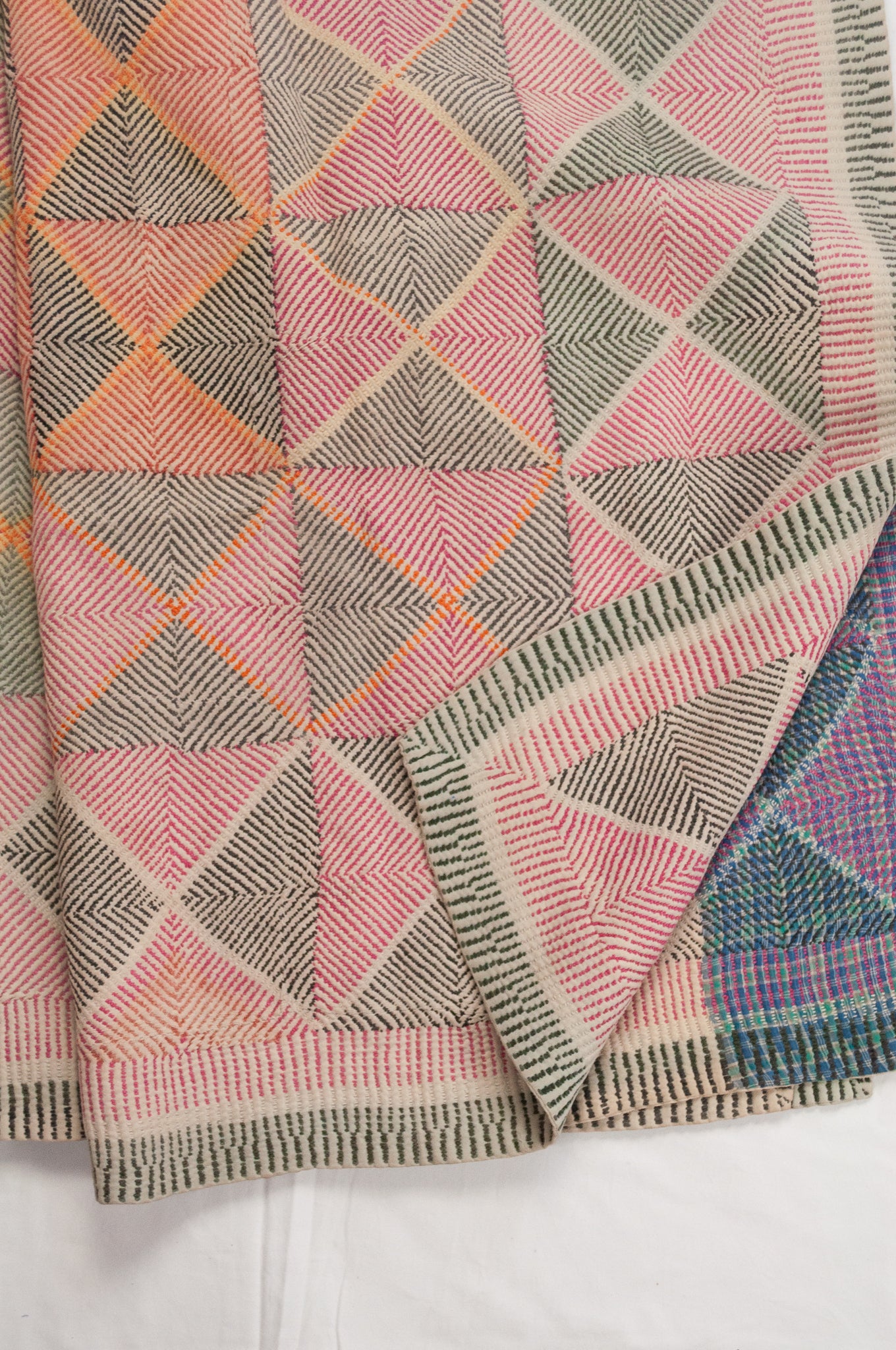 Vintage lohori wave kantha quilt red and olive and orange triangle stitch pattern.