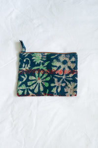 VIntage kantha pouch in overdyed indigo floral design with red stitching.