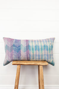 Lohori kantha stitch quilt cushion cover in aqua and pink stitching on stripe background.