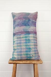 Lohori kantha stitch quilt cushion cover in aqua and pink stitching on stripe background.