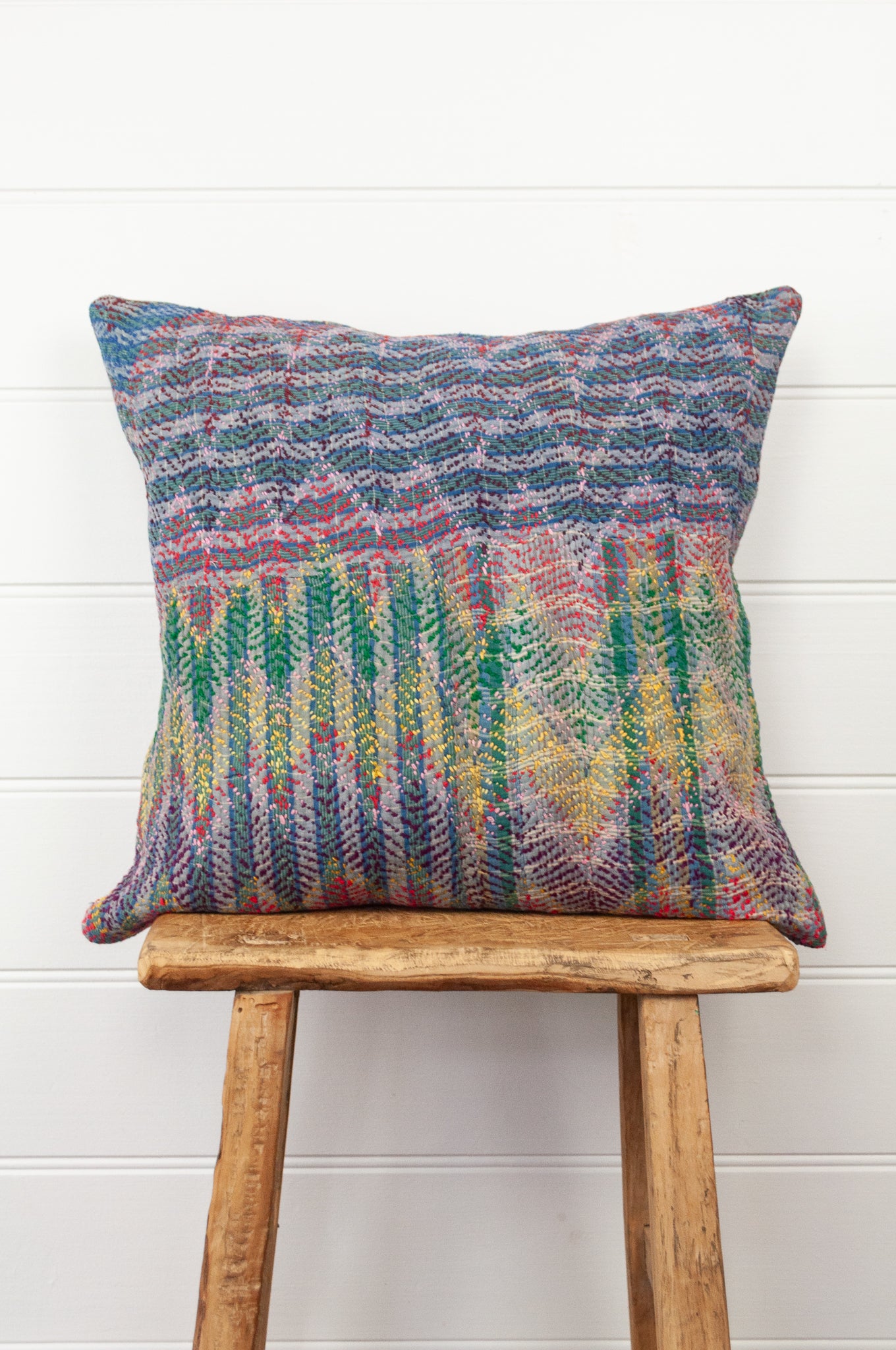Lohori kantha stitch quilt cushion cover in multi-colour stitching on stripe background.