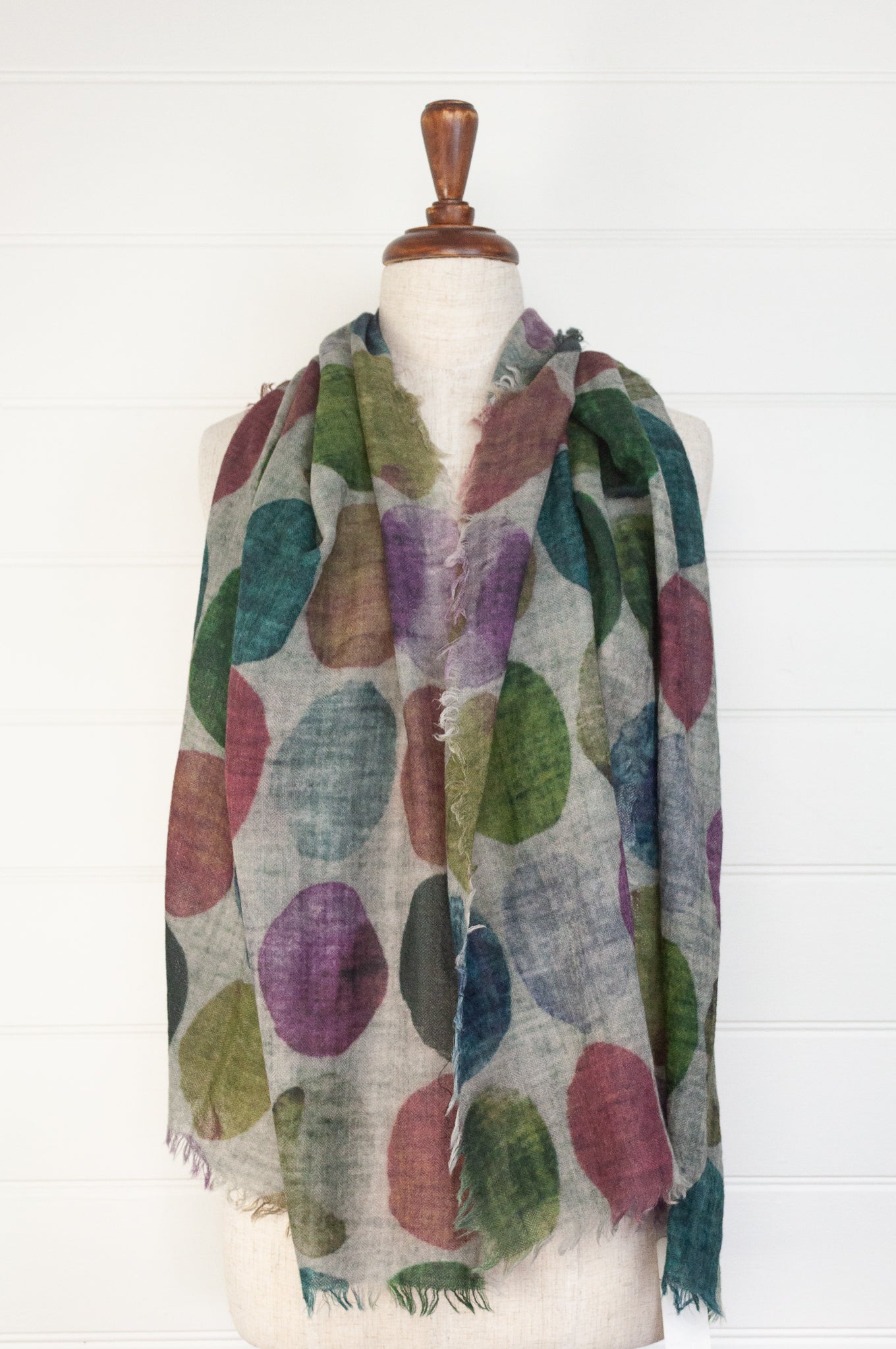 Juniper Hearth fine wool and modal scarf with multi coloured large dots on a blue grey background.