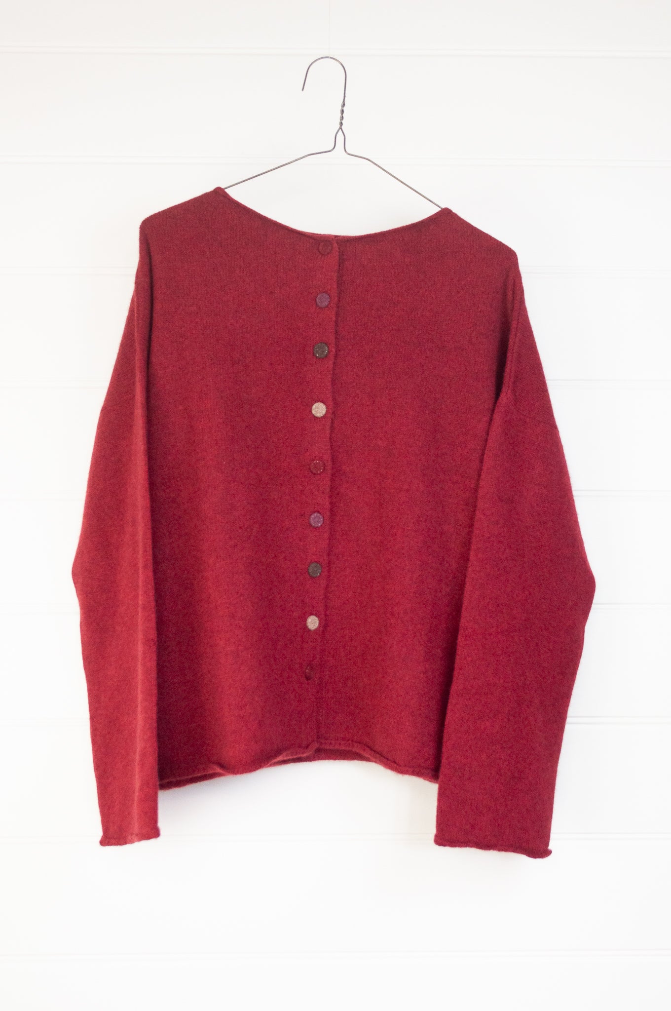 Baby yak one size reversible cardigan sweater with hand embroidered buttons in cherry red.