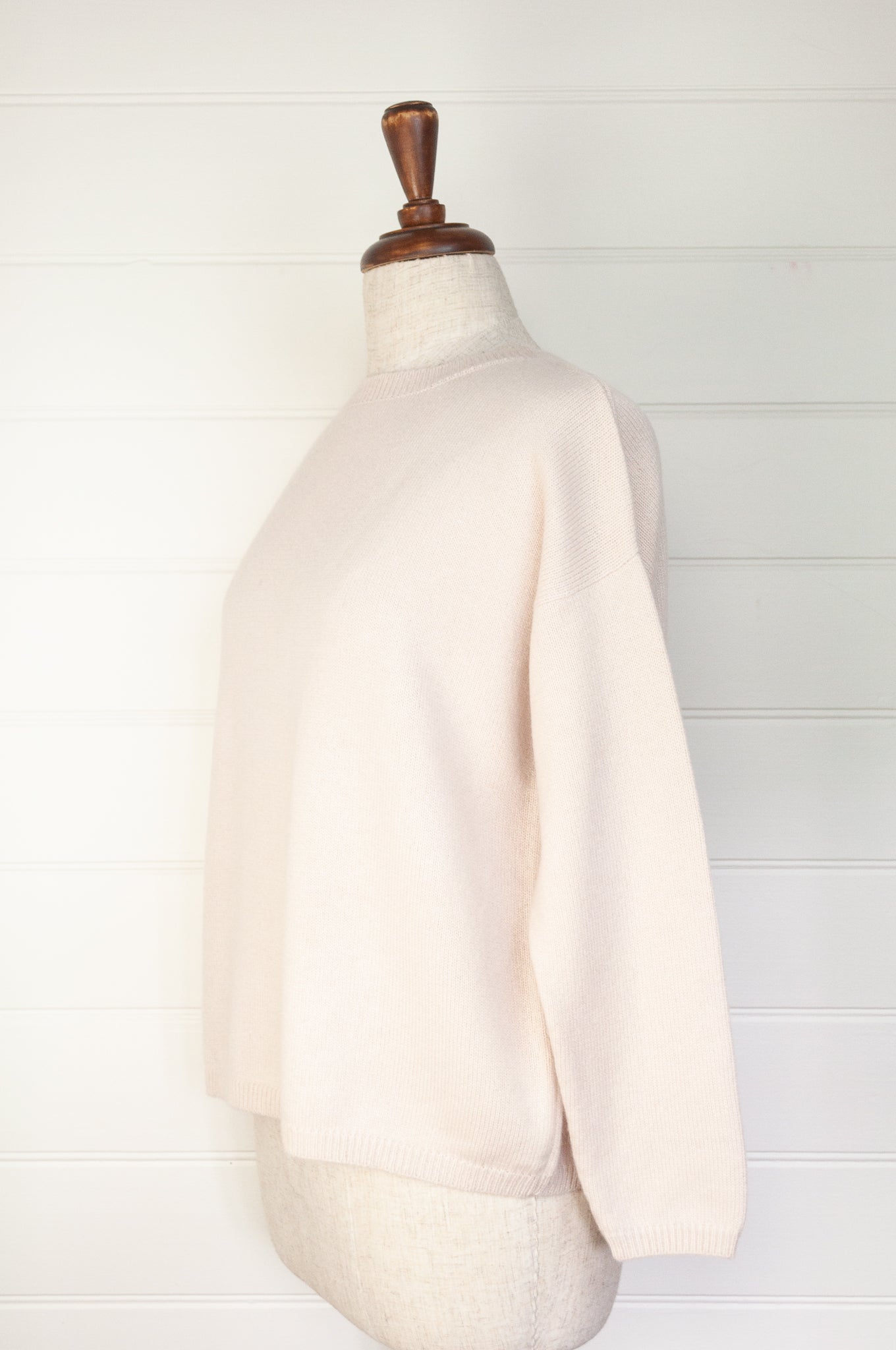 One size crew neck cashmere sweater ethically made in Nepal in blush ecru cream.