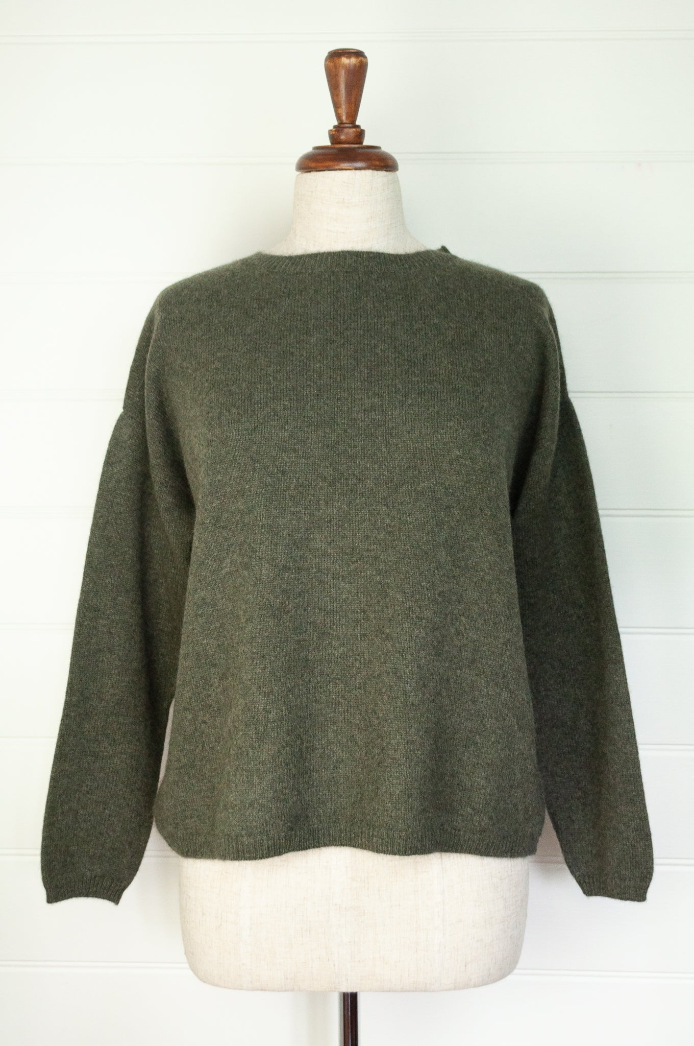 One size crew neck cashmere sweater ethically made in Nepal in olive green.