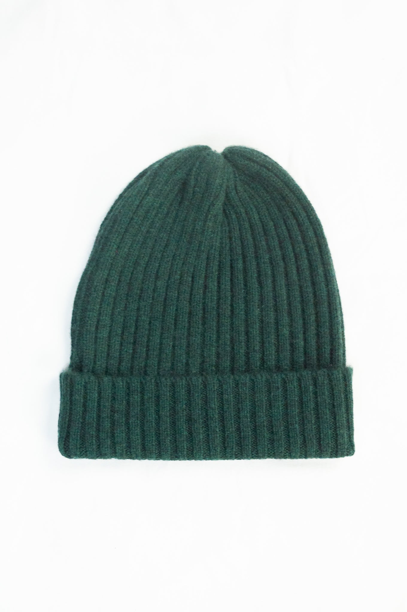 Juniper Hearth 100% cashmere ribbed knitted beanie in bottle green.