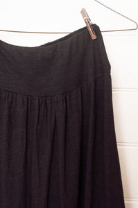 Valia made in Melbourne Gardener skirt in black wool jersey, elastic waist, gathered with frill at hem.