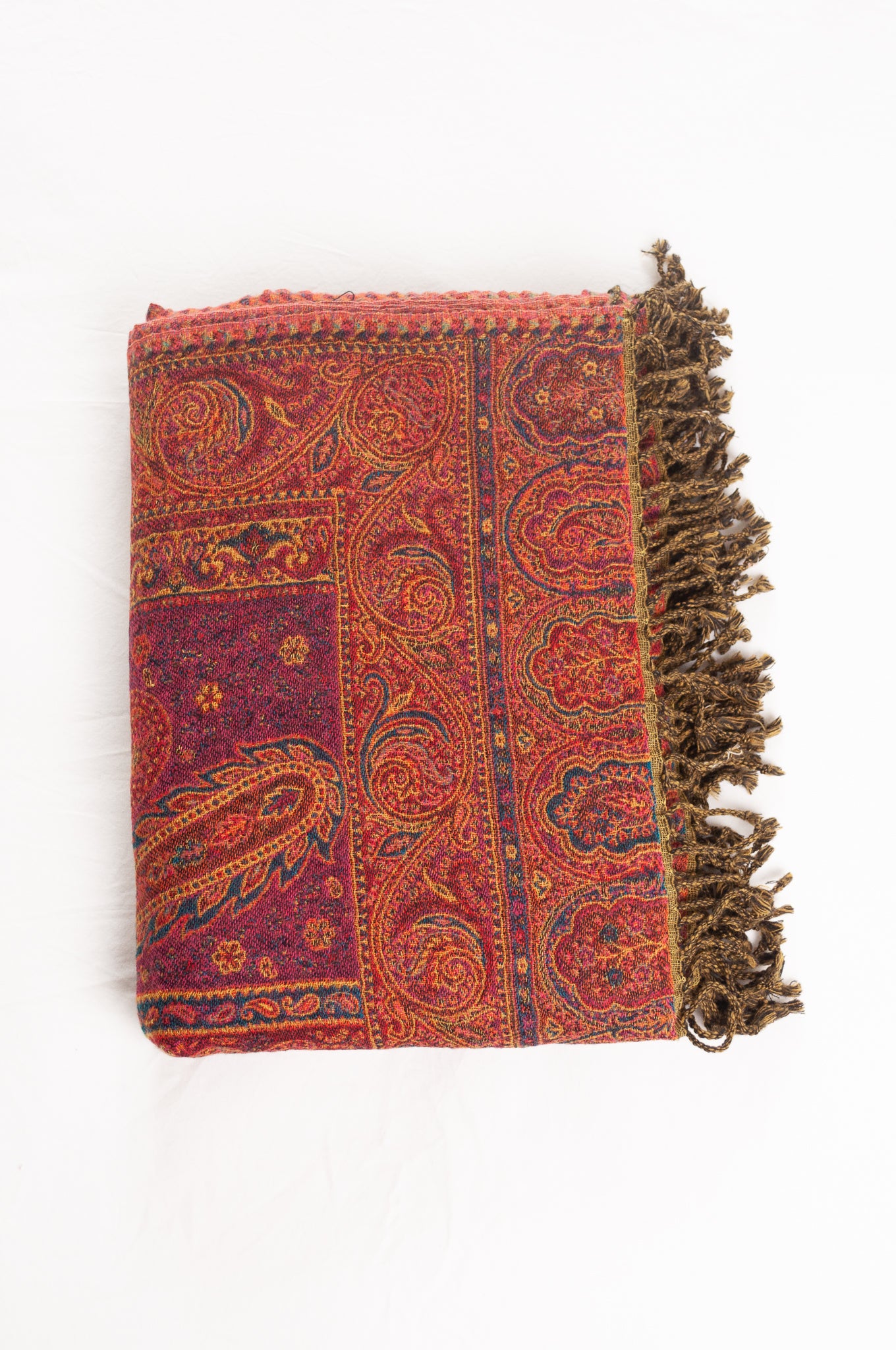 Juniper Hearth ruby and magenta, pure wool jacquard paisley tasseled throw.