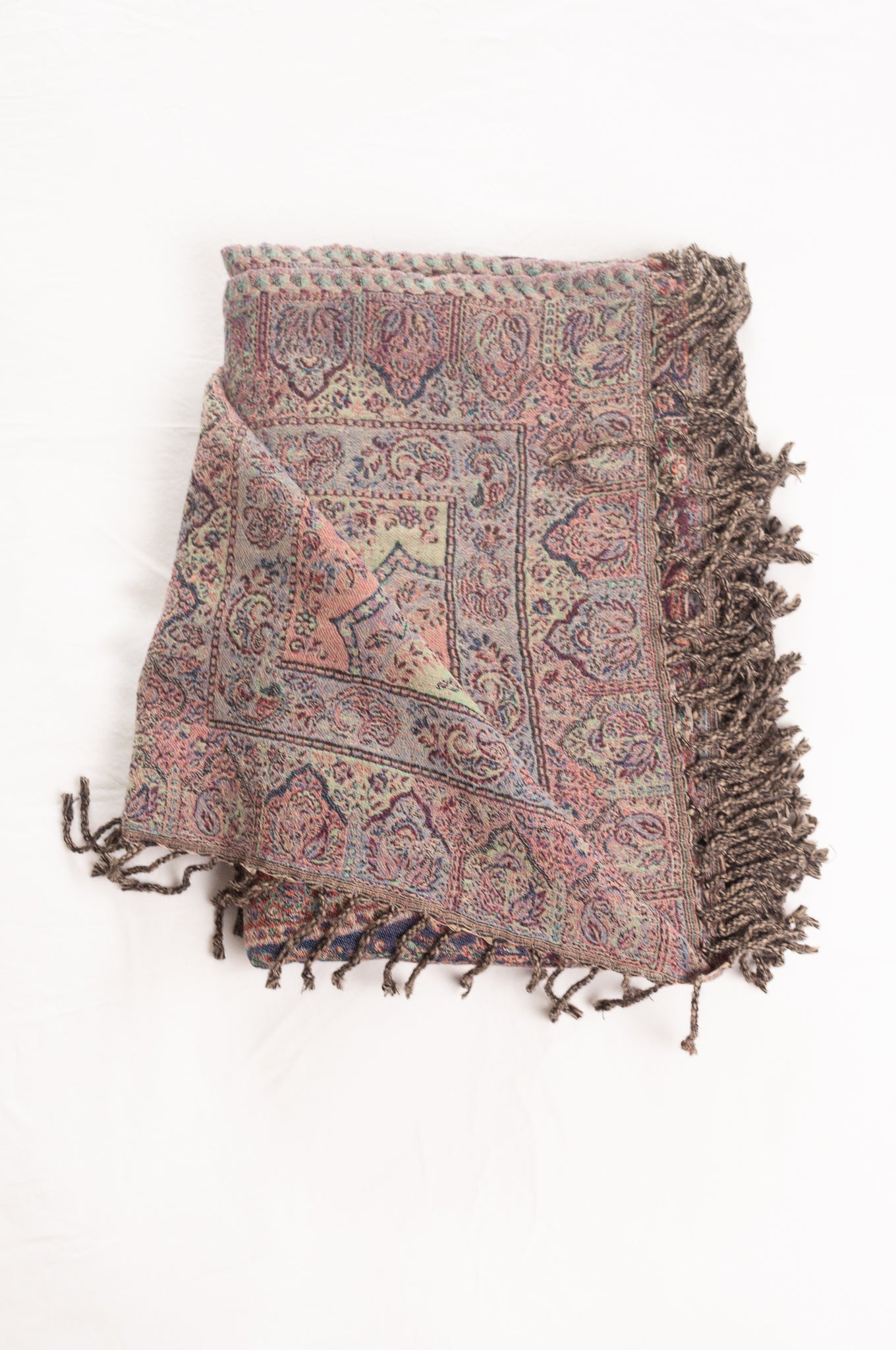 Juniper Hearth lilac pure wool jacquard paisley tasseled throw, with soft teal and denim blue and rust highlights.