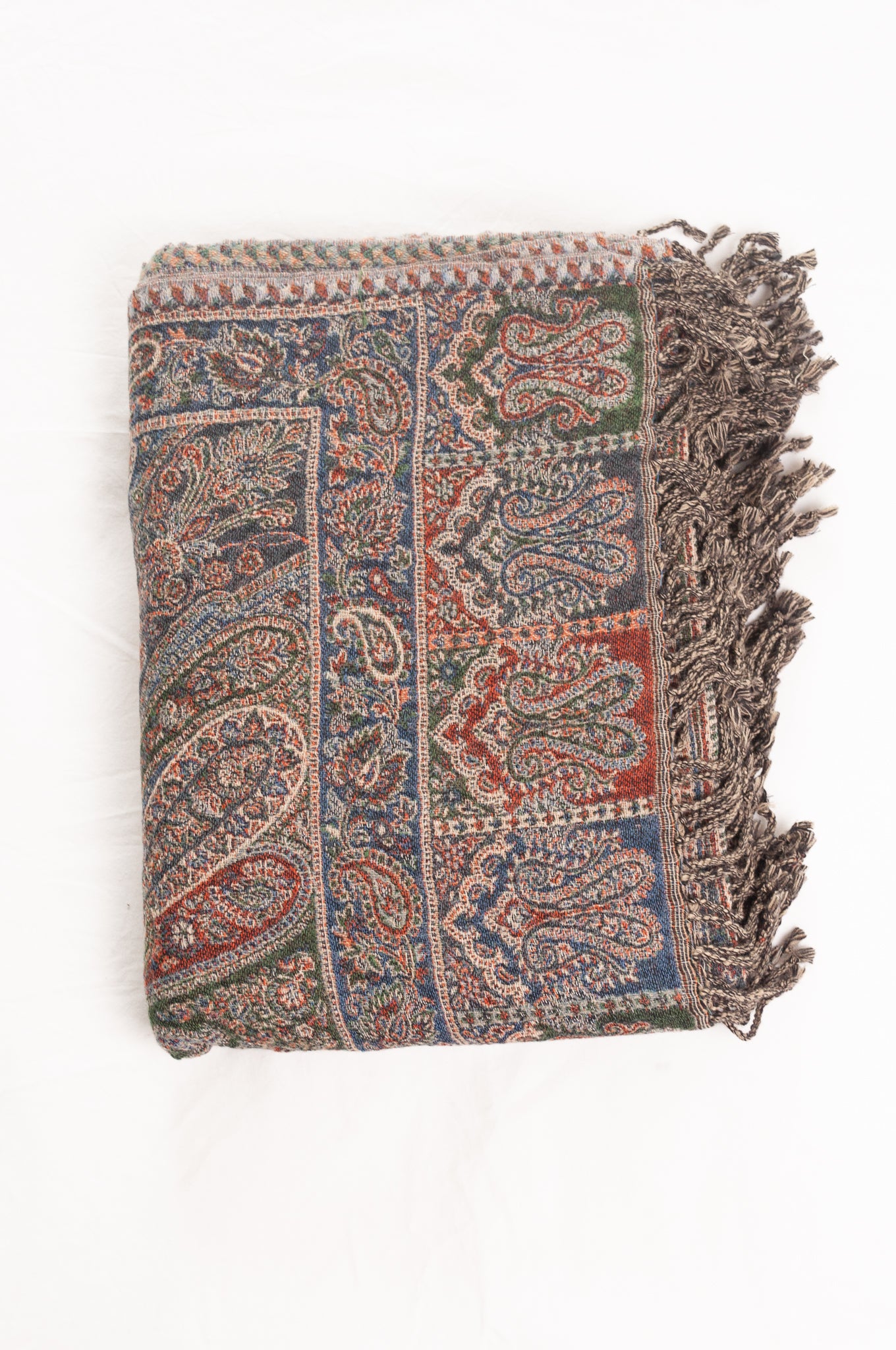 Juniper Hearth denim and rust pure wool jacquard paisley tasseled throw.