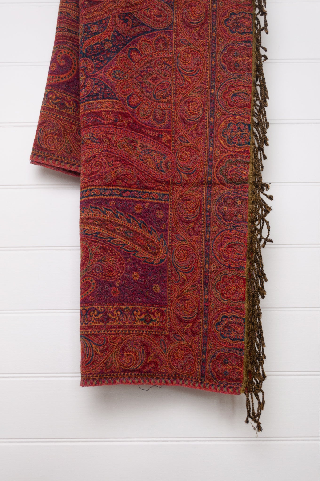 Juniper Hearth ruby and magenta, pure wool jacquard paisley tasseled throw.