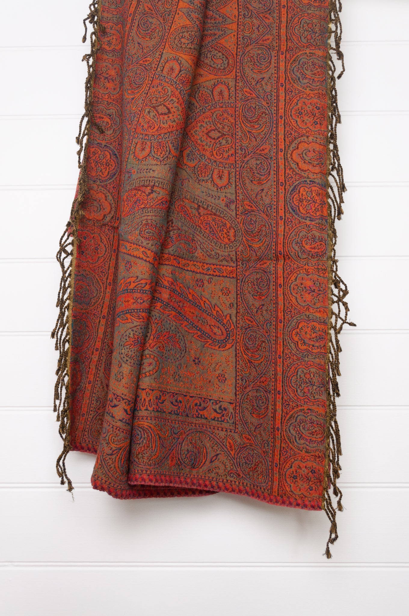 Juniper Hearth ruby and magenta, pure wool jacquard paisley tasseled throw.