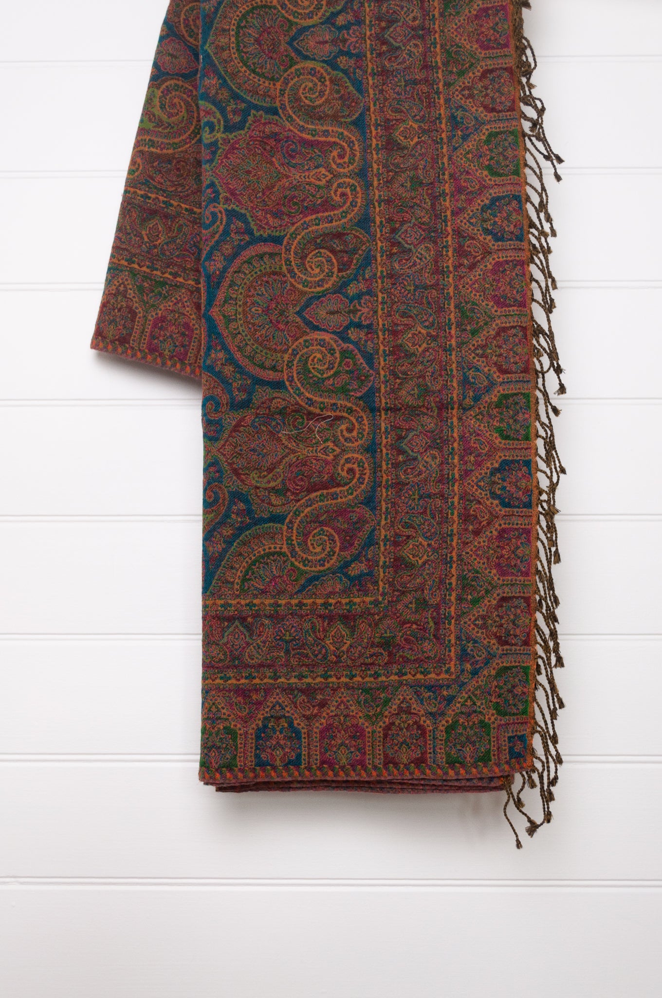 Juniper Hearth jewel tones, ruby sapphire and emerald, pure wool jacquard paisley tasseled throw.