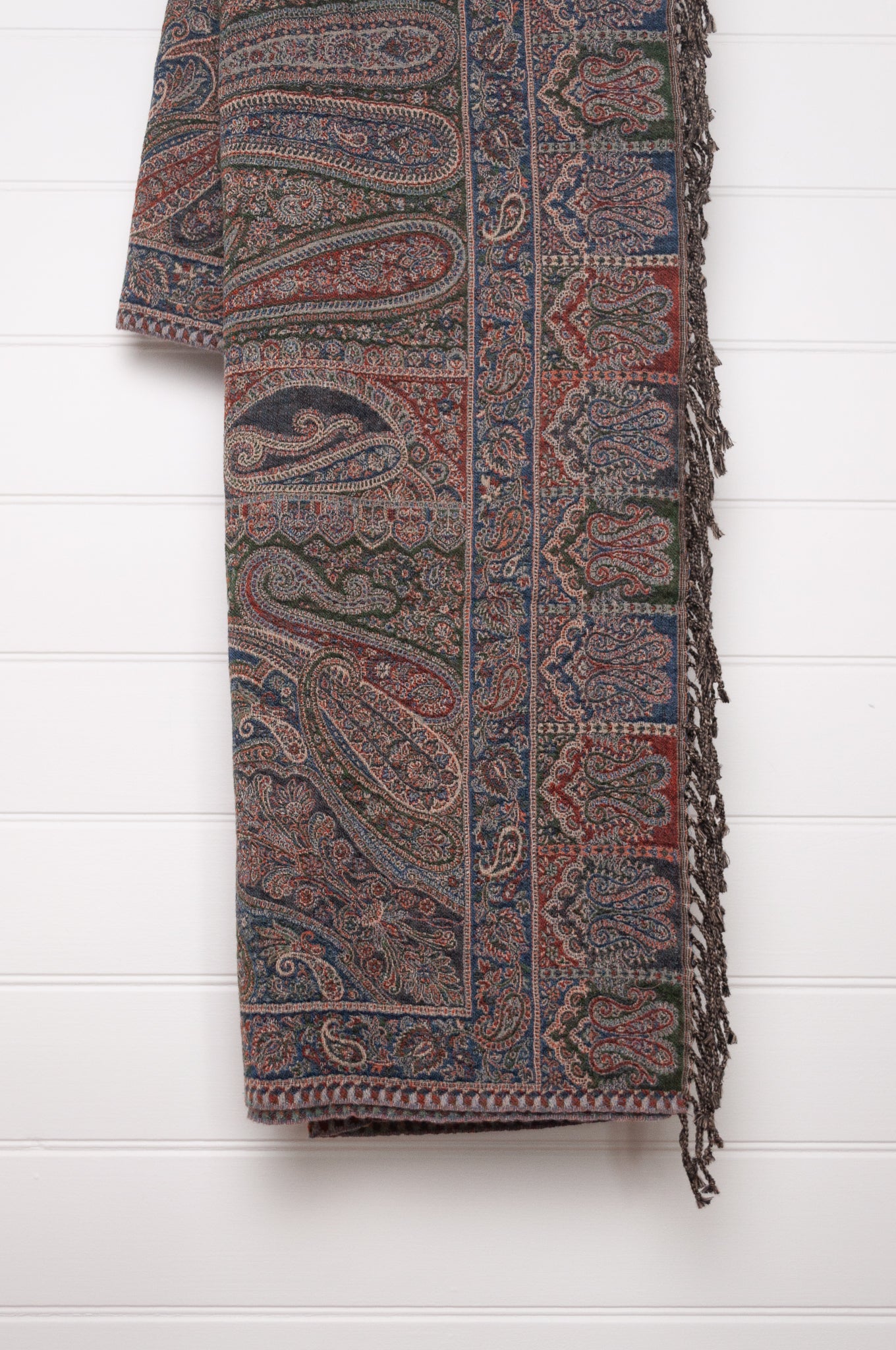 Juniper Hearth denim and rust pure wool jacquard paisley tasseled throw.
