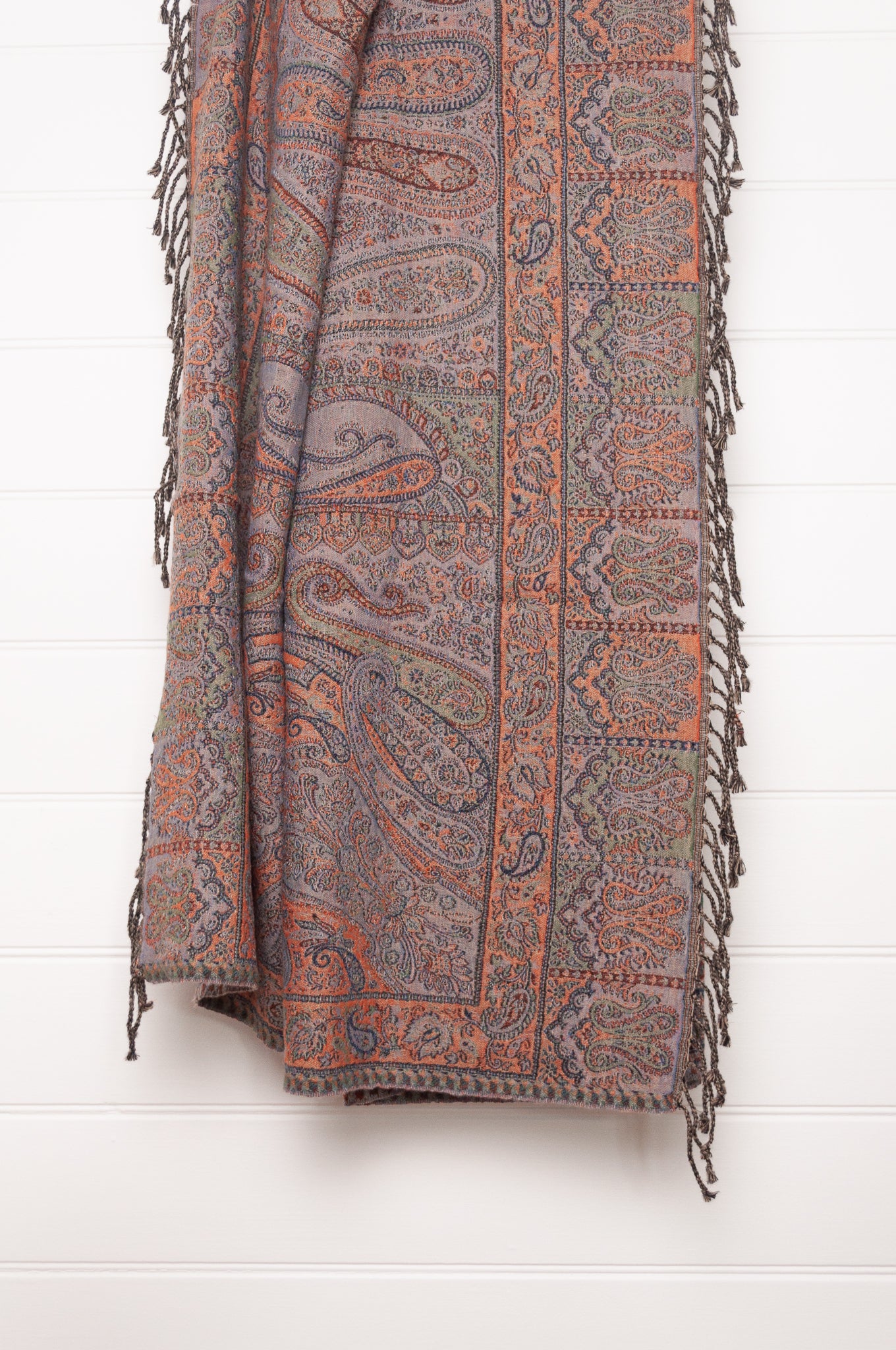 Juniper Hearth denim and rust pure wool jacquard paisley tasseled throw.