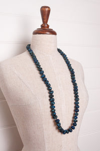 Neeru Kumar handmade fabric beads from silk shibori remnants in sapphire blue and green.