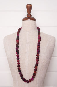 Neeru Kumar wool fabric bead necklace using remnants in magenta pink fabric.
