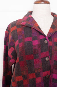 Neeru Kumar handwoven wool button up jacket in magenta, red and charcoal check.