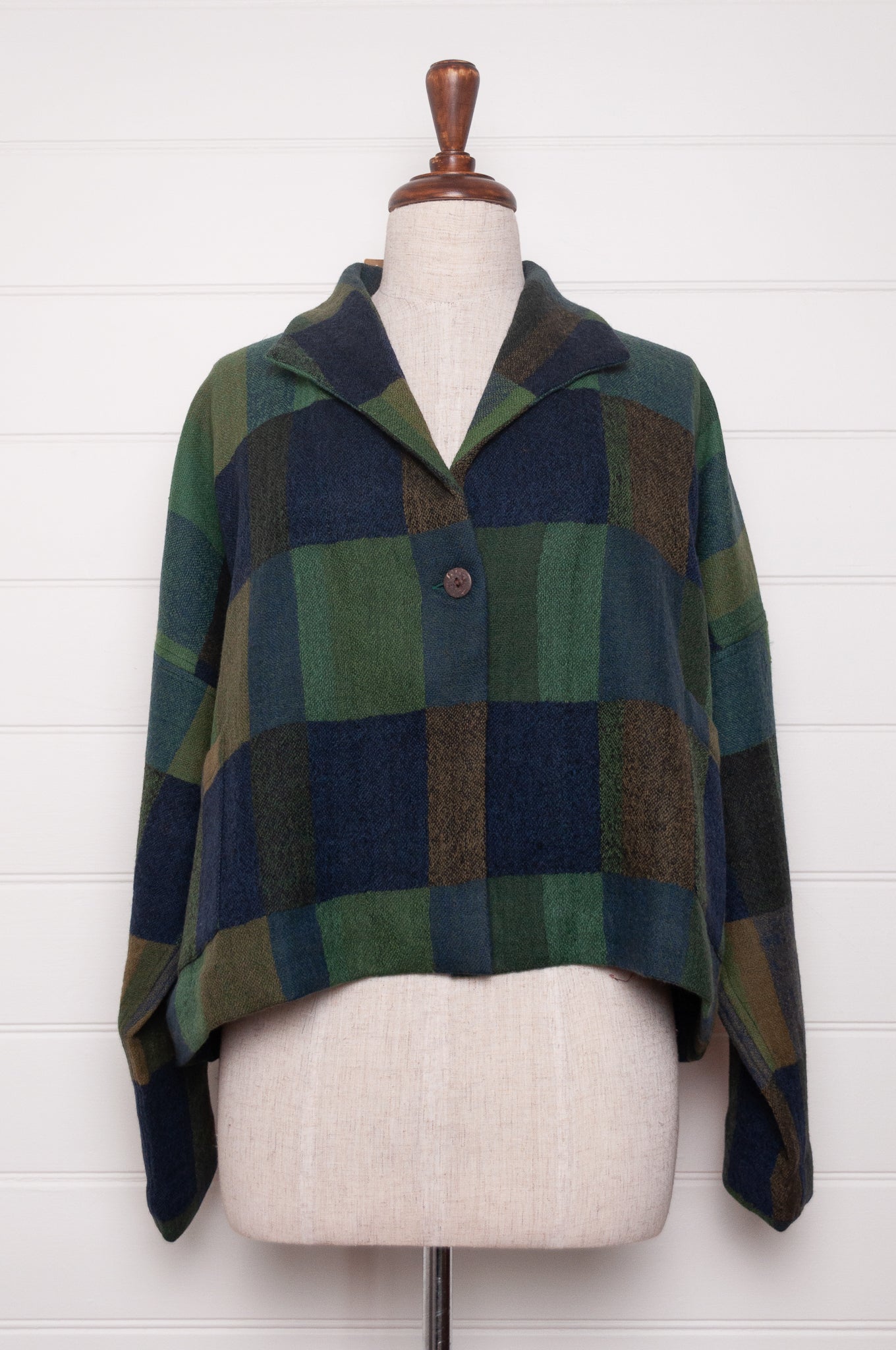 Neeru Kumar handwoven wool blanket check cropped loose fit jacket in indigo navy and emerald green.