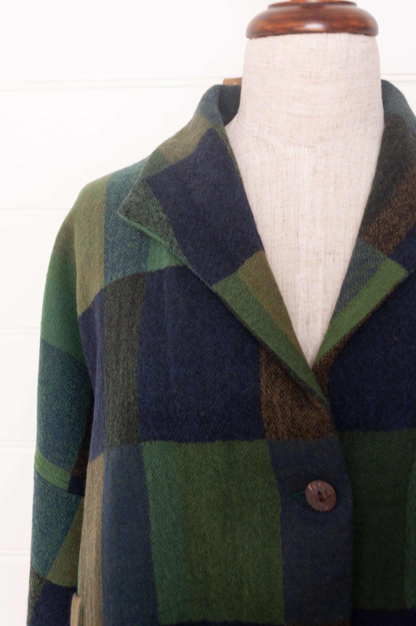 Neeru Kumar handwoven wool blanket check cropped loose fit jacket in indigo navy and emerald green.
