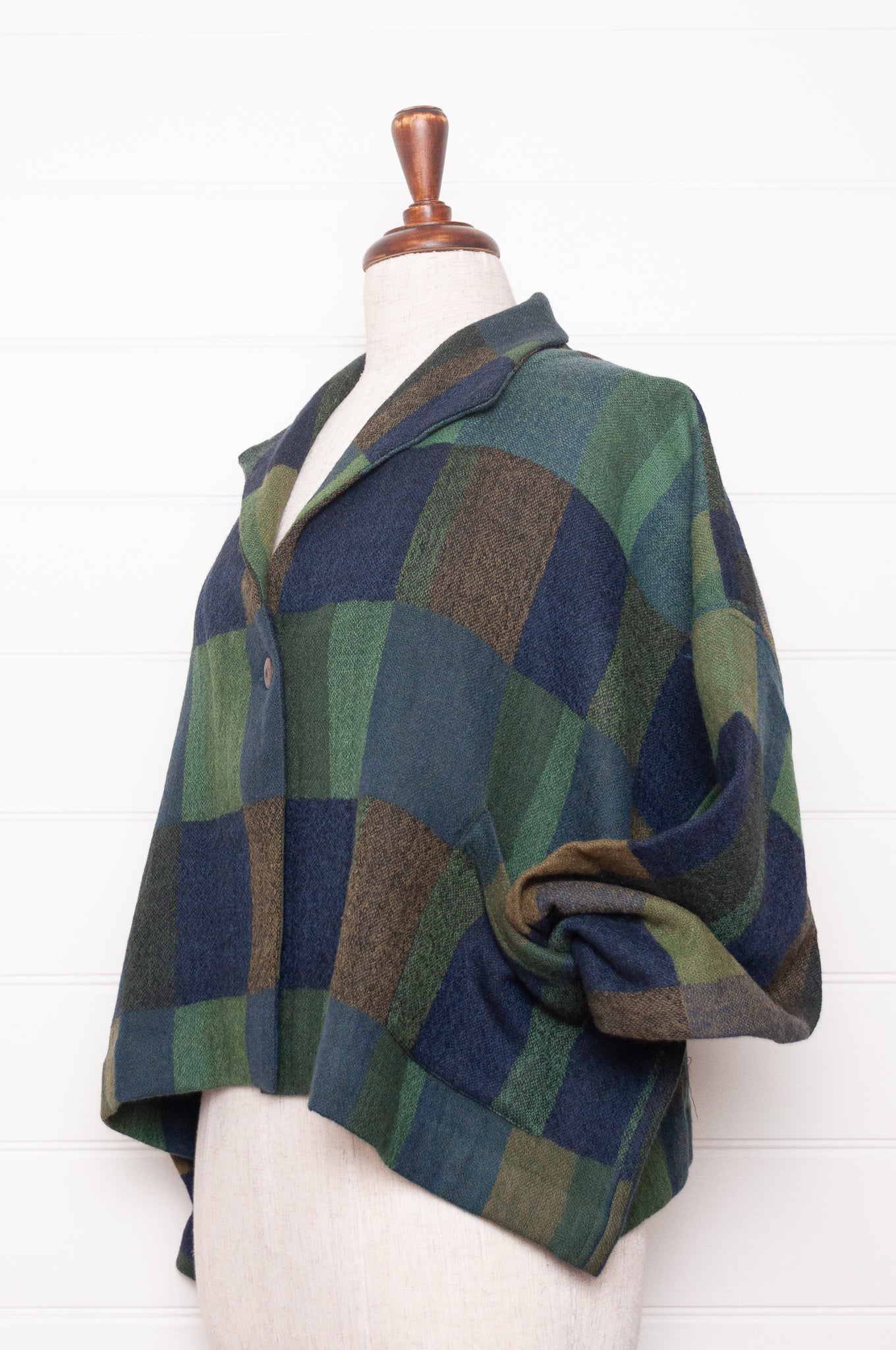Neeru Kumar handwoven wool blanket check cropped loose fit jacket in indigo navy and emerald green.