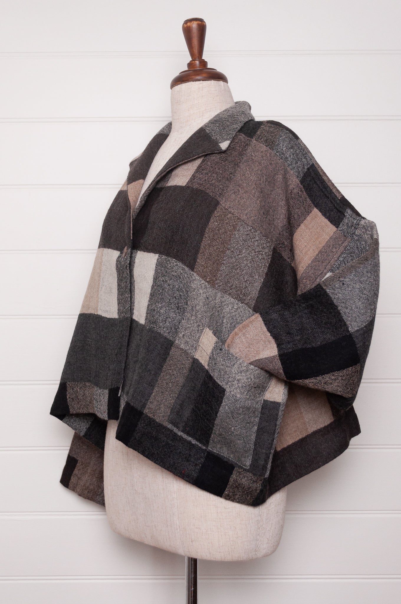 Neeru Kumar Coco jacket in blanket check wool, monochrome tones of charcoal, black, beige, latte and brown.