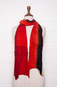 Neeru Kumar pure wool crinkle finish shibori scarf in vermilion red and black.